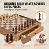 A close-up view of a wooden chess set with pieces arranged on the board, and a drawer pulled out. Anteprima dell’immagine prodotto