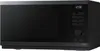A black Samsung microwave oven is shown from the side, displaying the time 12:00 on its digital interface. Anteprima dell’immagine prodotto