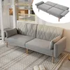 A gray sofa bed is shown in a living room setting with a rug and books. Voir les images du produit