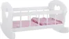 A white wooden doll's cradle with a pink blanket inside, shown from a side angle. Produktbild-Vorschau