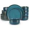 A stack of teal-colored ceramic plates and bowls. Náhled obrázku produktu