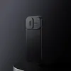 A black phone case with a camera cover is displayed on a dark, minimalist background. Náhled obrázku produktu
