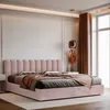 A bedroom scene with a pink upholstered bed as the main focus. Anteprima dell’immagine prodotto