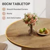 A close-up of a round wooden tabletop with a vase of flowers and fruit on it, with text highlighting product features. Produktbild-Vorschau