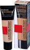 A product shot of a foundation bottle and its packaging. Podgląd zdjęcia produktu