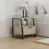 A modern nightstand next to a bed. Produktbild-Vorschau