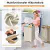 A woman is holding a laundry basket in a laundry room with shelves of folded towels in the background. Voir les images du produit