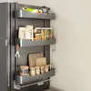 A multi-tiered shelf unit attached to the side of a refrigerator, filled with various kitchen items. Anteprima dell’immagine prodotto