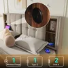A bed with a tufted headboard, featuring built-in storage shelves and charging ports. The image highlights the charging features with a close-up inset and icons at the bottom. Produktbild-Vorschau
