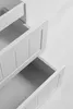 A close-up, overhead view of a white bathroom vanity with three drawers, two of which are partially open. Anteprima dell’immagine prodotto