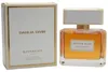 Givenchy Dahlia Divin Eau de Parfum: bernsteinfarbener Flakon mit weißem Deckel, daneben schlichte weiße Verpackung mit Goldrand. Podgląd zdjęcia produktu