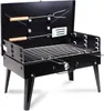 A black portable grill with its lid open, showing the cooking grate and two grilling tools. Voir les images du produit