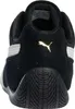 The back view of a black Puma sneaker with a gold Puma logo. Produktbild-Vorschau