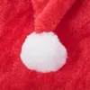 A close-up view of a red Santa hat with a white pom-pom. Anteprima dell’immagine prodotto