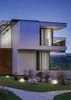 A modern house at dusk with illuminated spherical garden lights on the lawn. Produktbild-Vorschau