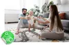 A family playing with a baby on a play mat in a living room. Produktbild-Vorschau
