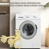 A plush giraffe toy is placed in front of a washing machine, suggesting it is washable. Produktbild-Vorschau