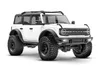 A white Ford Bronco 2021 RC car with large off-road tires, presented on a white background. Produktbild-Vorschau