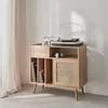 A wooden cabinet with a record player and headphones on top, and records stored inside. Anteprima dell’immagine prodotto