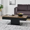 A modern living room scene featuring a coffee table with a book and a decorative bowl. Anteprima dell’immagine prodotto
