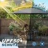 An outdoor patio scene with a large umbrella providing shade. Voir les images du produit