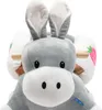 Close-up of a plush donkey toy with large ears and a white snout, against a white background. The toy has brown handles and white saddlebags decorated with pink strawberries and green leaves. Náhled obrázku produktu