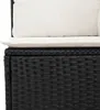 Close-up of a black rattan sofa with white cushions. Produktbild-Vorschau