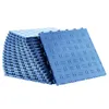 A stack of interlocking garage floor tiles, with one tile prominently displayed in the foreground. Anteprima dell’immagine prodotto