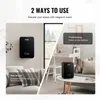 The image shows two ways to use a black diffuser: wall-mounted and freestanding on a table. Voir les images du produit