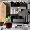 A coffee machine with a cup of coffee and accessories on a countertop. Produktbild-Vorschau