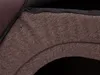 A close-up view of the textured fabric and zipper of a dark brown pet bed. Náhled obrázku produktu