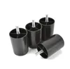 Four black plastic furniture feet with threaded bolts are arranged on a white background. Produktbild-Vorschau