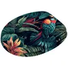A colorful parrot sits on a branch amidst lush tropical foliage. Náhled obrázku produktu