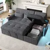 A grey sectional sofa with storage compartments open, revealing folded blankets and pillows. The sofa has LED lighting on the side and a USB port. Produktbild-Vorschau