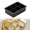 A black silicone ice cube tray is shown above a glass filled with ice cubes. Náhled obrázku produktu