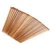 A collection of wooden knitting needles arranged in a fan shape against a white background. Podgląd zdjęcia produktu