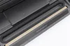 A close-up view of the sealing bar of a vacuum sealer machine. Podgląd zdjęcia produktu