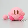 A crocheted Kirby figurine sits on a white surface. Produktbild-Vorschau