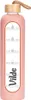 A pink glass water bottle with a bamboo lid and a leather strap. Voir les images du produit