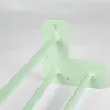 A close-up shot of three pastel green hairpin legs attached to an L-shaped bracket, against a white background. Produktbild-Vorschau