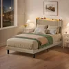 A bedroom scene at night with a bed, nightstands, and a window. Produktbild-Vorschau