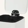 Close-up view of the hinge mechanism and the top edge of an open trash can. Náhled obrázku produktu