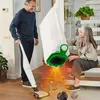 A man is vacuuming with a cordless vacuum cleaner, while a woman holds up a dust bag. Dust particles are shown being sucked into the bag, with close-ups of dust and debris. Produktbild-Vorschau