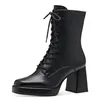 A black lace-up boot with a block heel and platform sole, shown against a white background. Produktbild-Vorschau