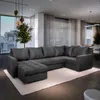 A spacious living room with a large sectional sofa, dining area, and large windows with blinds. Produktbild-Vorschau