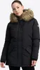 A woman wearing a black winter jacket with a fur-lined hood. Produktbild-Vorschau