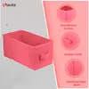 A pink storage box is shown with feature callouts on a pink and gray background. Produktbild-Vorschau