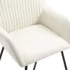 Close-up view of a cream-colored fabric chair seat and armrest. Produktbild-Vorschau