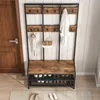 A hallway storage unit with a bench and shoe rack, next to a wooden door. Podgląd zdjęcia produktu