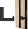 A black metal hook is shown next to a wooden acoustic panel. Produktbild-Vorschau